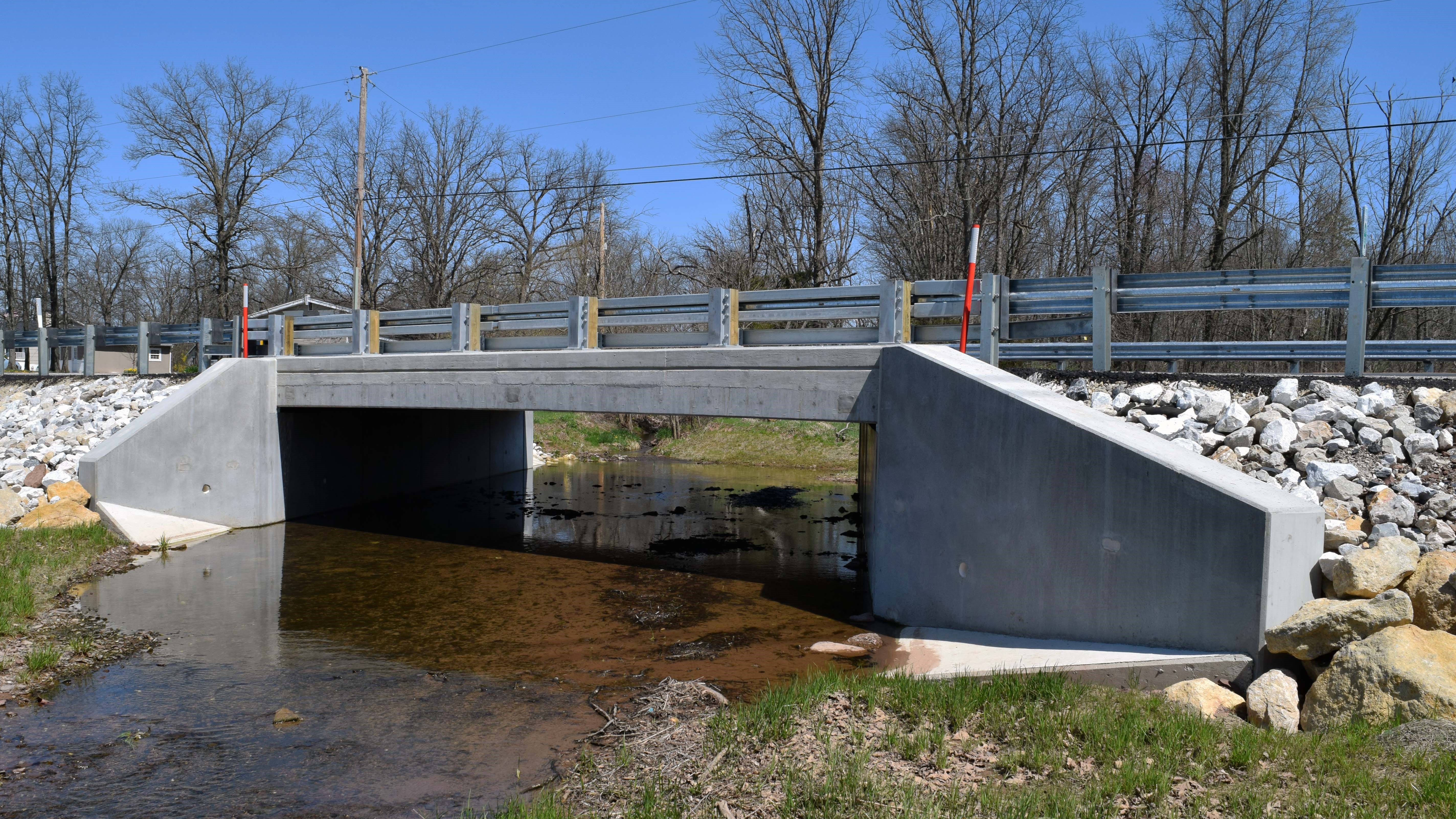 Newly completed bridge with river running underneath